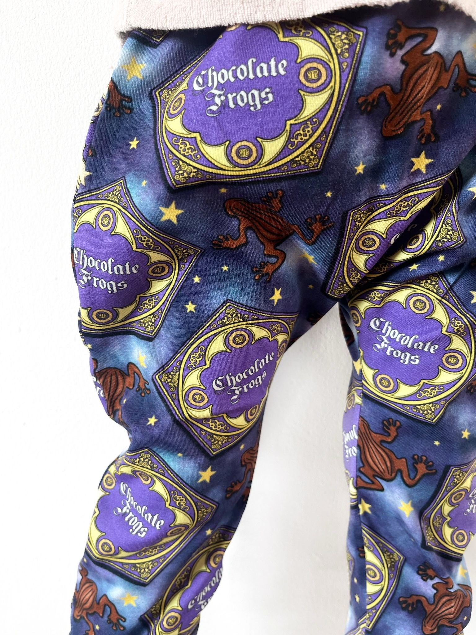 Kids harem pants with magical chocolate frog print and starry background