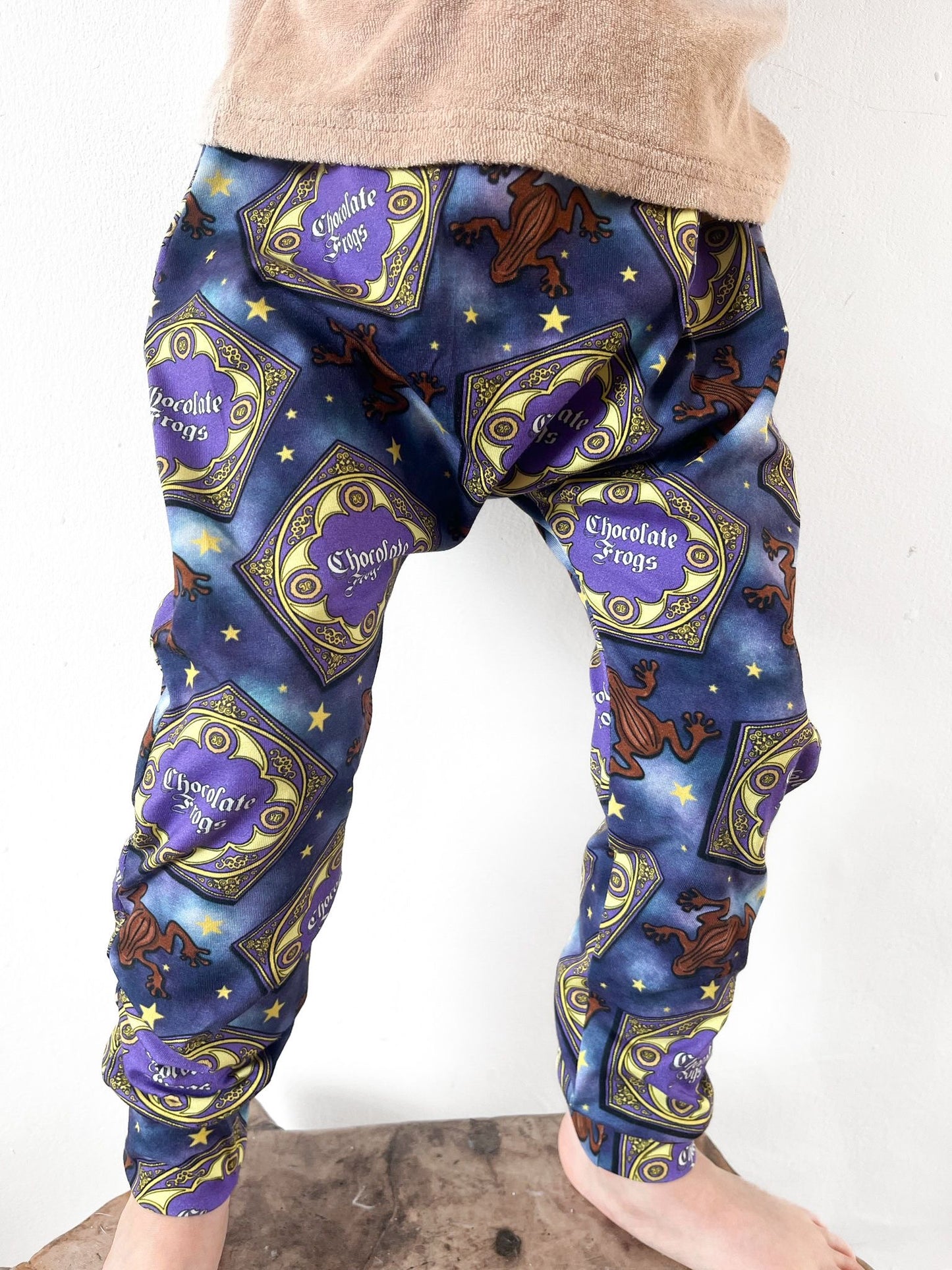 Kids harem pants with magical chocolate frog print and starry background