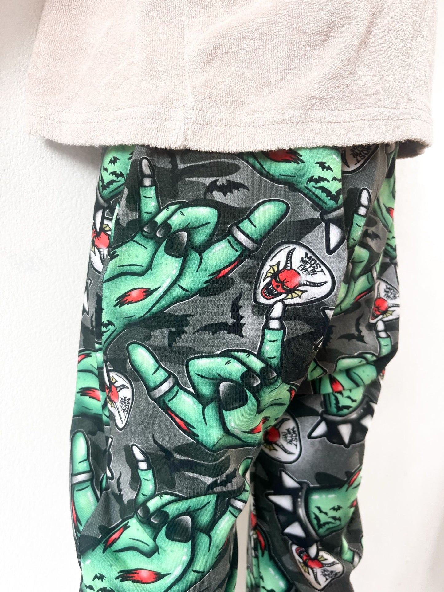 Kids harem pants with zombie rock hand print and metal-inspired design